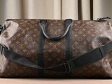 louis vuittou bag sitting on a table in front of a curtain