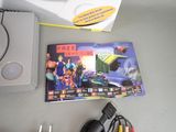 a video game on the table next to a game controller