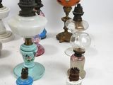 a lot of different colored glass lamps on a table
