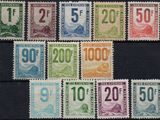 a close up of a bunch of stamps with numbers on them