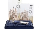 a pen sitting on top of a box with a picture of a castle in the background