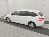 a picture of a white car parked in a garage