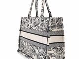 a black and white tote bag with a pattern on it
