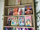 a book shelf that has a lot of books on it