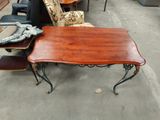a table that is sitting on the floor in front of a couch