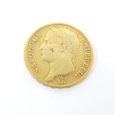 l'image d'une pièce d'or sur laquelle figure le visage d'un homme