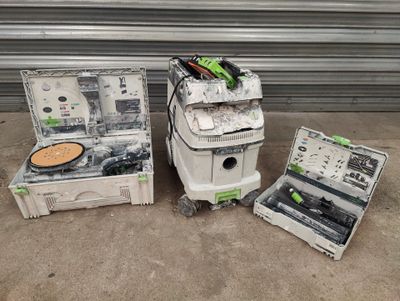 three different tools that are sitting on the ground