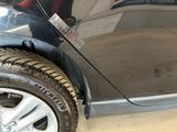 a close up of a tire on a car in a showroom