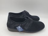 the children ' s shoes are black and have a floral design on them