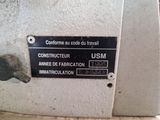 a sign on the side of a machine that says construction usm