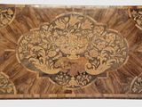 a wooden table with a floral design on it