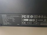 the back panel of a laptop with a lot of stickers on it