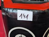 a black and red trash can with two black and white trash cans in it