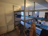 a room with a lot of boxes on the shelves