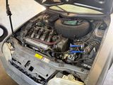 a car with its hood open and the engine in the back