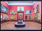 a painting of a room with paintings on the walls