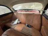 an image of a car with a leather seat in the back