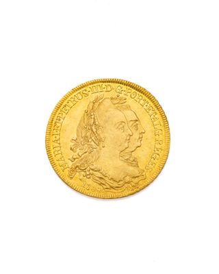gros plan d'une pièce d'or sur fond blanc