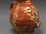 an image of a vase with a handle on a gray background