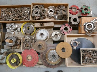 a box full of assorted metal parts on the floor