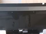 a black television sitting on top of a table