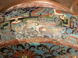 a close up of a colorful vase with designs on it