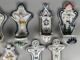 seven ceramic figurines that are sitting on a table