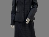 an image of a mannequin wearing a suit and skirt