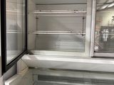 an empty refrigerator in the middle of a room