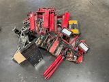 a pile of tools on the floor in a warehouse