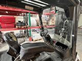 a close up of a forklift inside of a warehouse