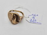 a close up of a gold ring with a tag on it