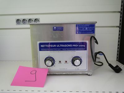 an image of a laboratory machine with a note on the counter