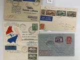 several different types of stamps and envelopes on a white surface