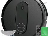 un gros plan d'un robot aspirateur avec sa télécommande