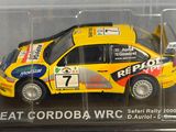 a model of a yellow car in a clear display case