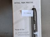 a black pen that is in a box on a table