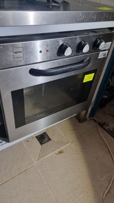 a silver oven with two burners on top of it in a kitchen