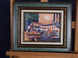 a picture of a painting on a easel in a room