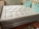 a mattress that is sitting on a bed in a room