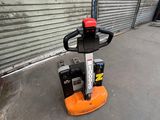 a small machine that is sitting in a garage