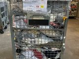 a metal cart with a lot of shoes on it in a warehouse