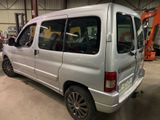 a silver van that is parked in a garage