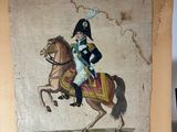 a painting of a man riding a horse on display