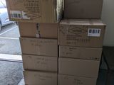 many boxes stacked on top of each other in a room