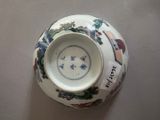 a white vase with a blue and white design on it