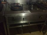 a stove top with a frying pan on it in a kitchen
