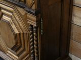 a wooden cabinet with a door on the top of it
