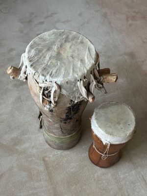 a drum and a drumet sitting on the floor