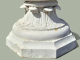 a bird that is sitting on top of a pedestal